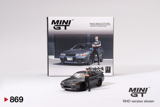 Nissan SKYLINE GT-R (R32) NISMO NISMO GUNMETAL AVEC FIGURINE TSUGIO MATSUDA 1992 (RHD) MINI GT 1:64