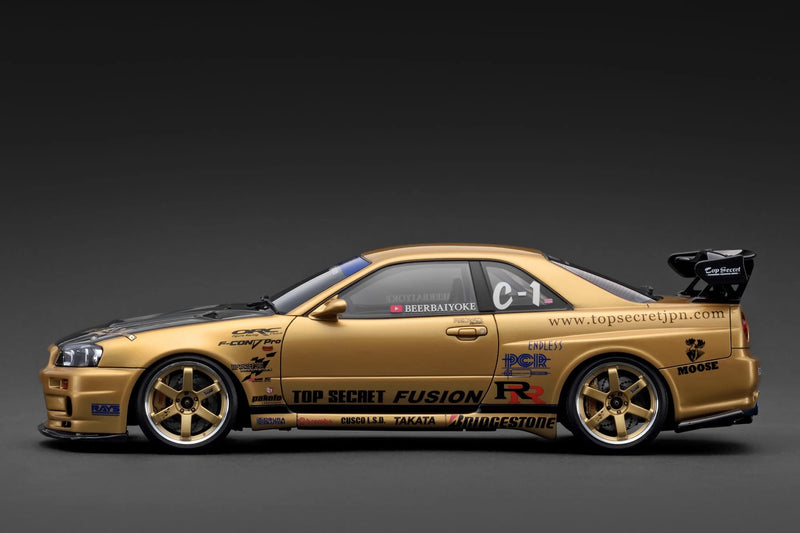 Laad de afbeelding in de Gallery-viewer, Nissan TOP SECRET 34GT-R (BNR34) Goud IGNITION MODEL 1:18
