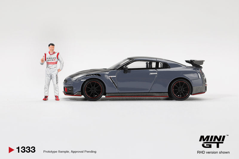 Laad de afbeelding in de Gallery-viewer, NISSAN GTR R35 NISMO TSUKUBA PRODUCTION CAR LAP RECORD WITH MATSUDA FIGURE TSUGIO MATSUDA 2024 MINI GT 1:64
